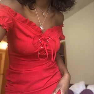 Red over-the-shoulder dress.